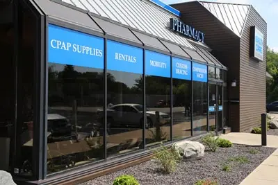 The store's glass front with blue signs above the windows.